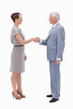 White hair man face to face with a woman and shaking hands clipart