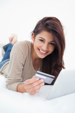 Close up, woman smiling with credit card and tablet in hand, lyi clipart