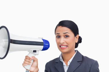 Close up of afraid saleswoman with megaphone clipart