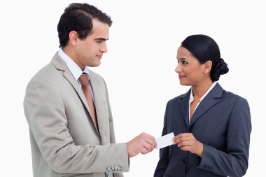 Business partners exchanging business cards clipart