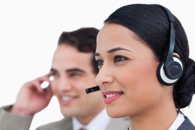 Close up side view of call center agents clipart