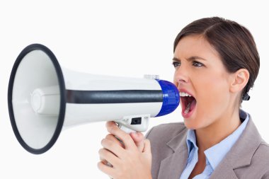 Close up of female entrepreneur yelling through megaphone clipart