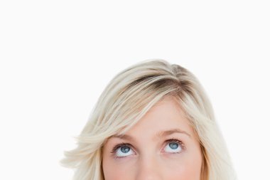 Upper part of the face of a blonde woman looking up clipart