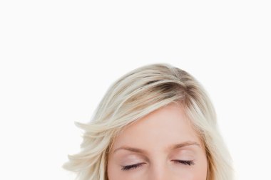 Woman closing her eyes while hiding the lower part of her face clipart