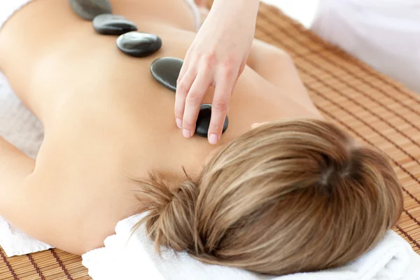 Relaxed woman having a stone therapy — Stock Photo, Image