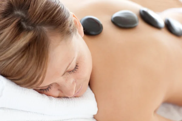 Close-up of a bright woman having a stone therapy — Stock Photo, Image