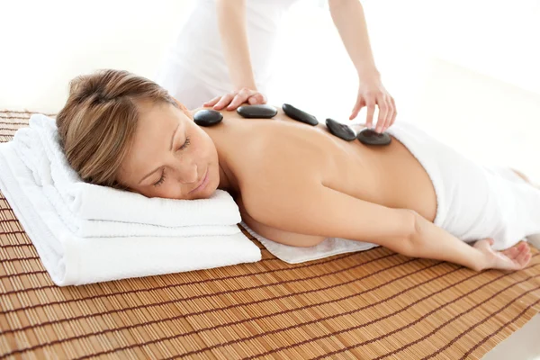 Delighted woman lying on a massage table — Stock Photo, Image
