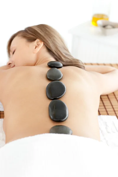 Happy woman lying on a massage table — Stock Photo, Image