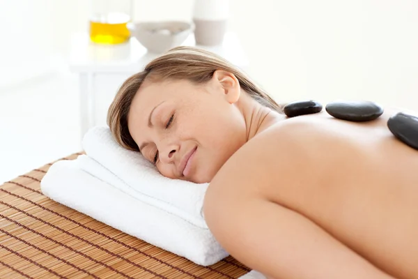 Beautiful woman relaxing on a massage table — Stock Photo, Image