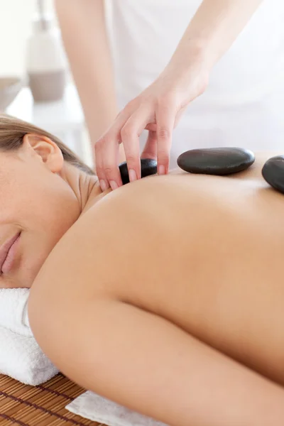 Delighted woman relaxing on a massage table — Stock Photo, Image