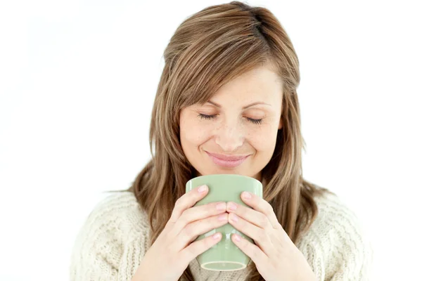 Delighted woman holding a cup a coffee — Stock Photo, Image