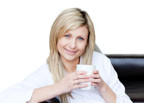 Self-assured woman holding a cup of coffee — Stock Photo, Image