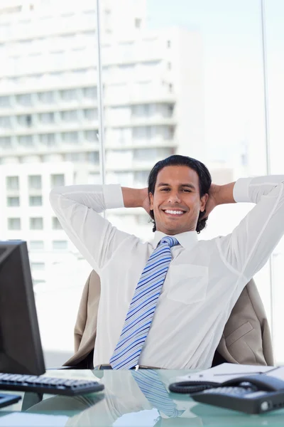 Portrait of a businessman relaxing in his office — Stock Photo, Image
