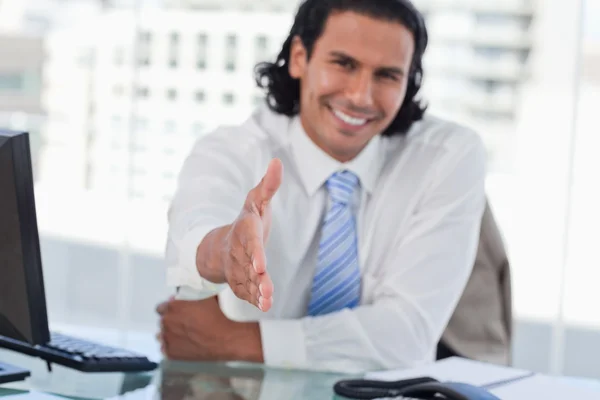 Businessman giving his hand — Stock Photo, Image