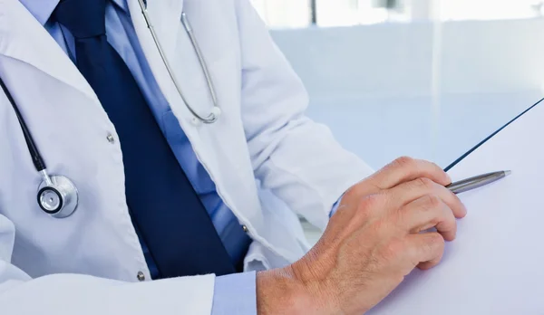 Close up of a doctor showing a document — Stock Photo, Image