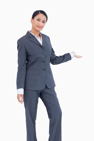 Standing businesswoman presenting — Stock Photo, Image