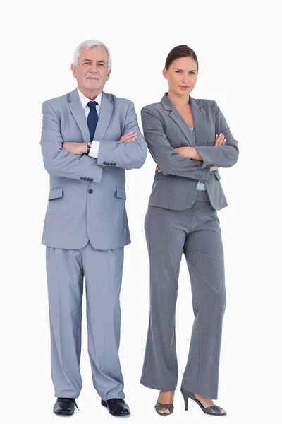 Mature businessman and colleague with arms folded — Stock Photo, Image