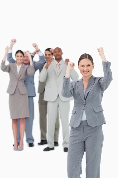 Cheering saleswoman with team behind her — Stock Photo, Image