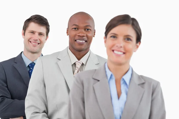 Smiling businesspeople standing together — Stock Photo, Image