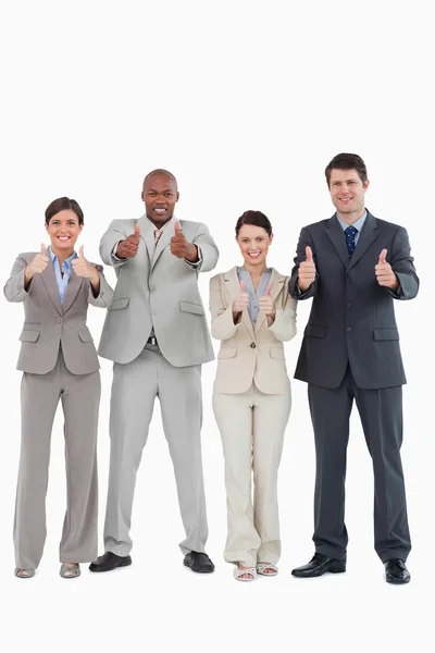 Businessteam giving thumbs up together — Stock Photo, Image