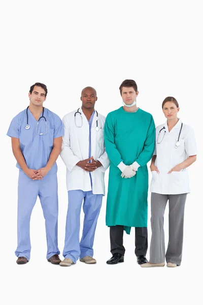 Jistý lékařský tým stojící dohromady — Stock fotografie