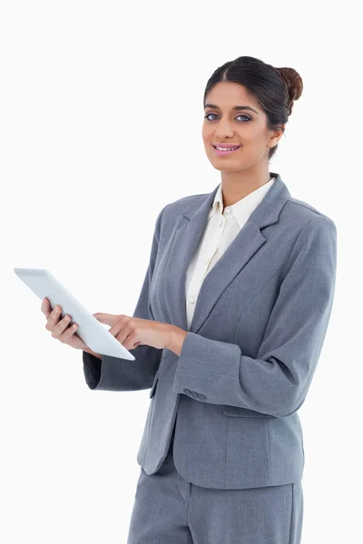 Smiling saleswoman using tablet computer — Stock Photo, Image