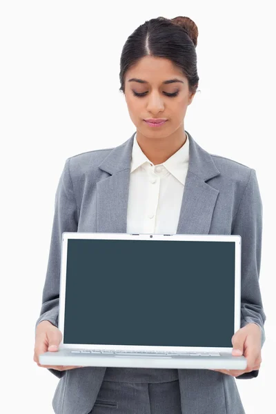 Businesswoman looking at notebook in her hands — Stock Photo, Image
