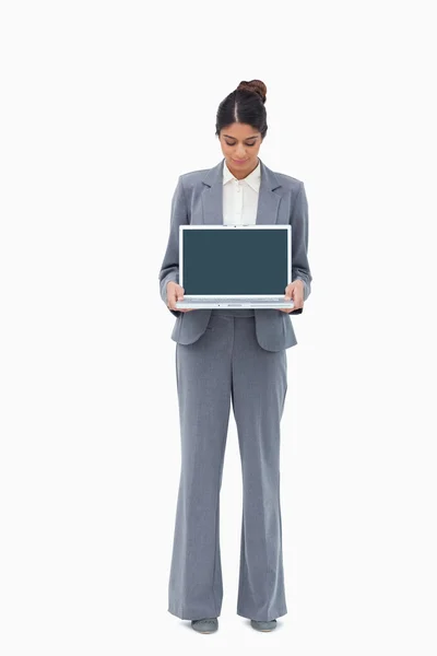 Saleswoman looking at notebook in her hands — Stock Photo, Image