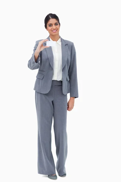 Smiling saleswoman showing blank business card — Stock Photo, Image