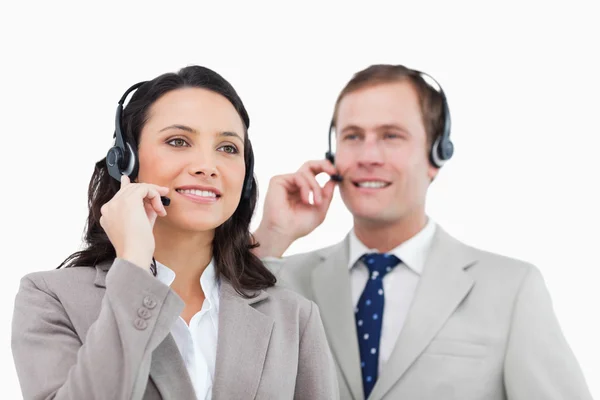 Telephone help desk employees with headsets — Stock Photo, Image