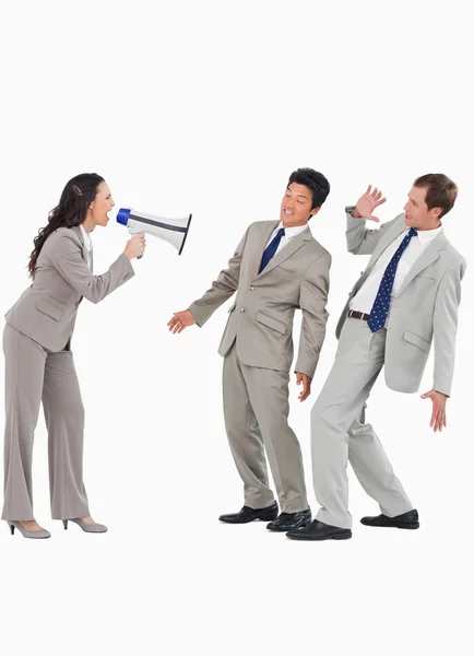 Saleswoman with megaphone yelling at colleagues — Stock Photo, Image