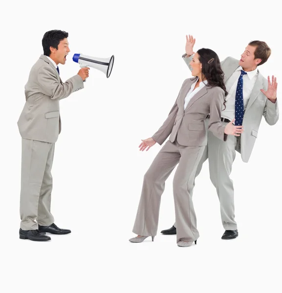 Salesman with megaphone shouting at colleagues — Stock Photo, Image