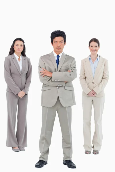 Confident businessman with his team behind him — Stock Photo, Image