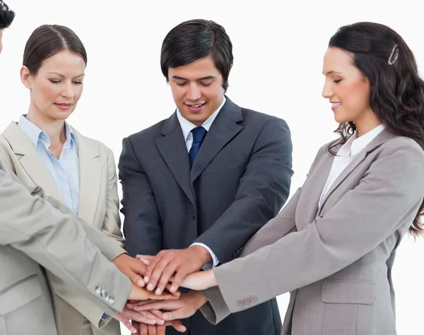 Young salesteam putting hands together — Stock Photo, Image