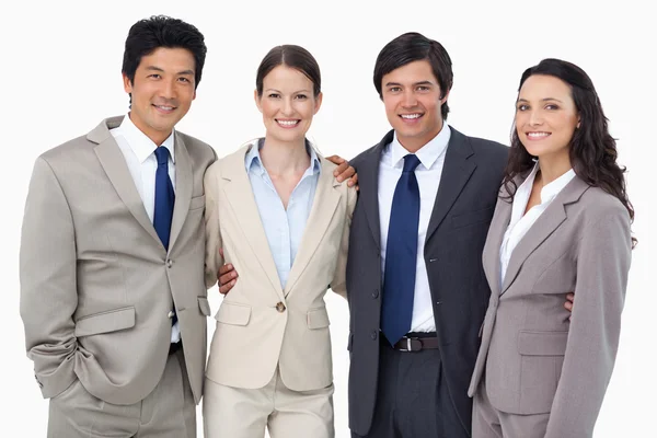Smiling salespeople standing together — Stock Photo, Image