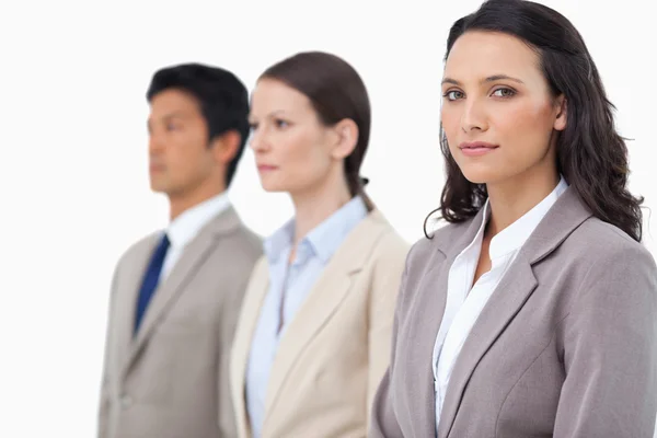 Businesswoman with colleagues next to her — Stock Photo, Image