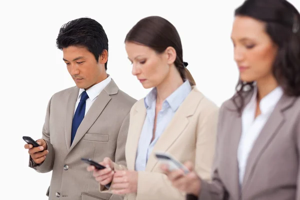 Young businessteam with their cellphones — Stock Photo, Image
