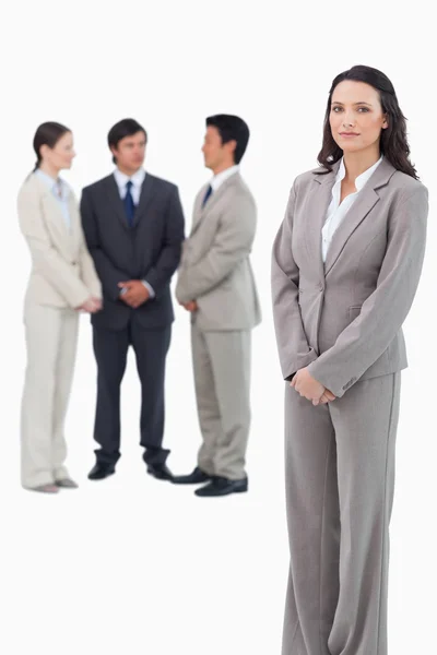 Saleswoman with team behind her — Stock Photo, Image