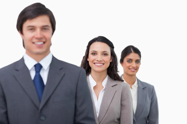 Smiling businesspeople standing in line — Stock Photo, Image