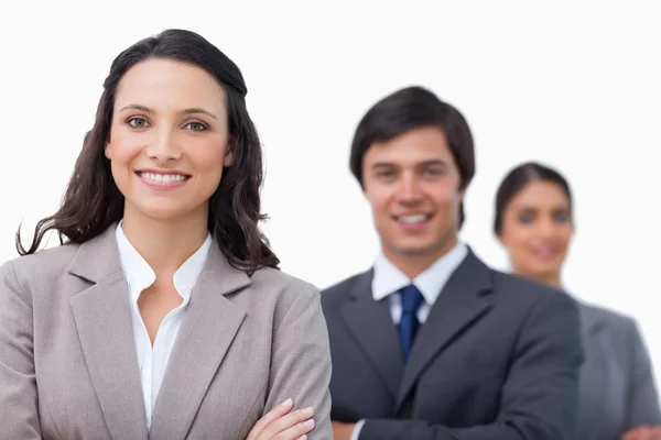 Smiling businesspeople standing with arms folded — Stock Photo, Image