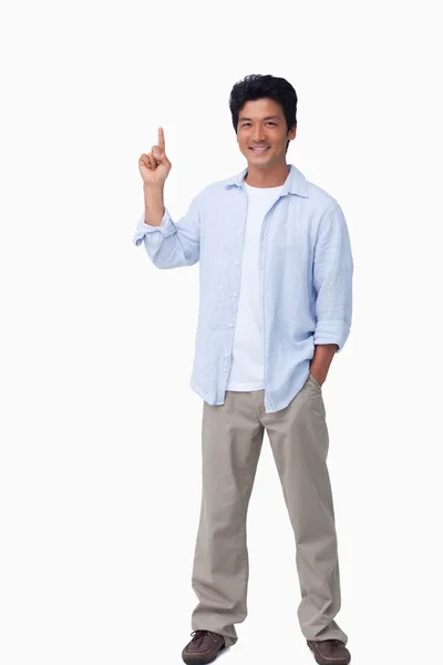 Smiling male pointing up — Stock Photo, Image