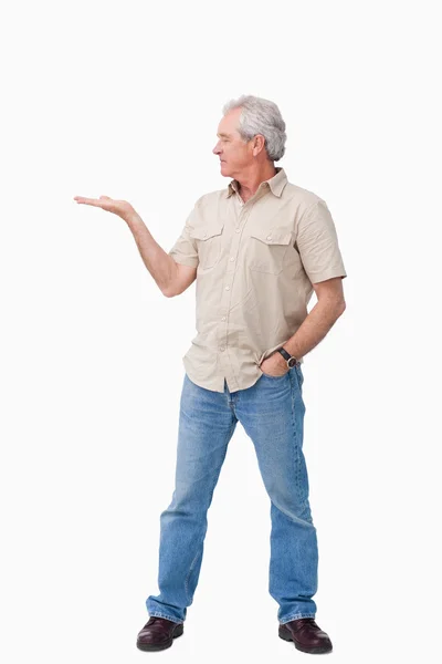 Mature male looking at his palm — Stock Photo, Image