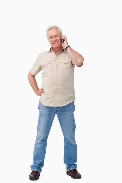 stock image Smiling mature male talking on his cellphone
