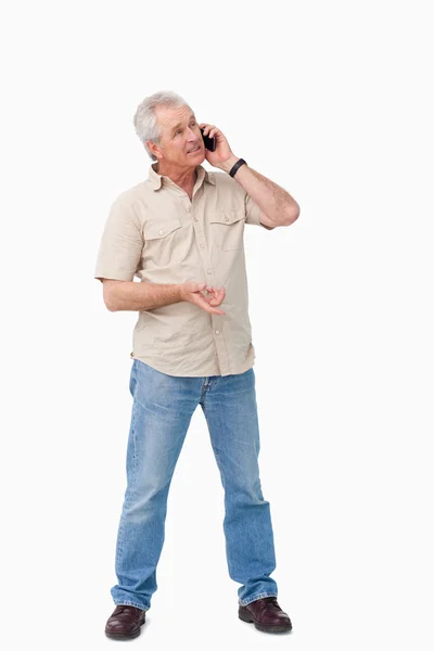 Dojrzały mężczyzna rozmawiać na swój telefon komórkowy — Zdjęcie stockowe