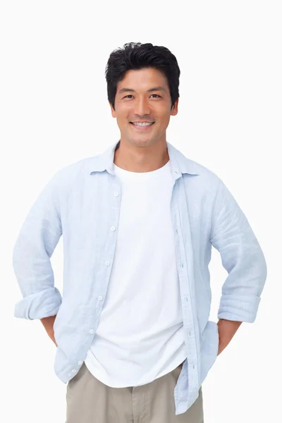 Smiling man with hands in his pockets — Stock Photo, Image