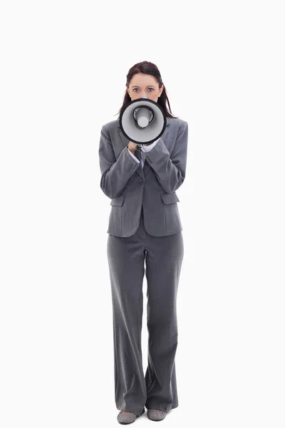 Businesswoman speaking in a megaphone — Stock Photo, Image