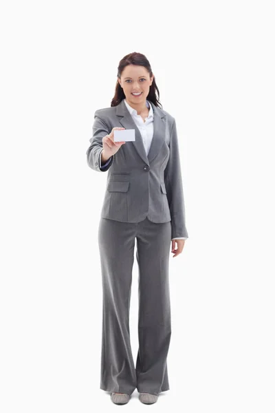 Businesswoman smiling showing a card — Stock Photo, Image