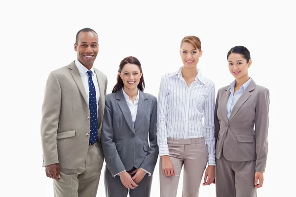 Business team smiling side by side — Stock Photo, Image