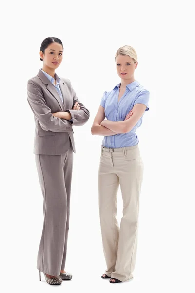 Two serious women crossing their arms — Stock Photo, Image