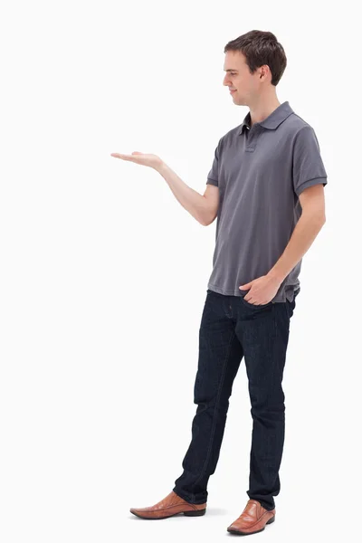 Standing man presenting — Stock Photo, Image